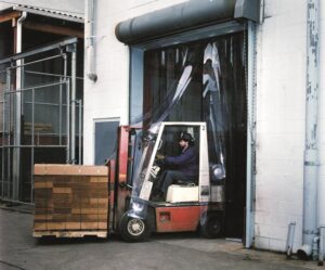 man carrying materials from warehouse